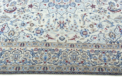 Corner detail of 2000s Nain rug showing border pattern and Wool pile