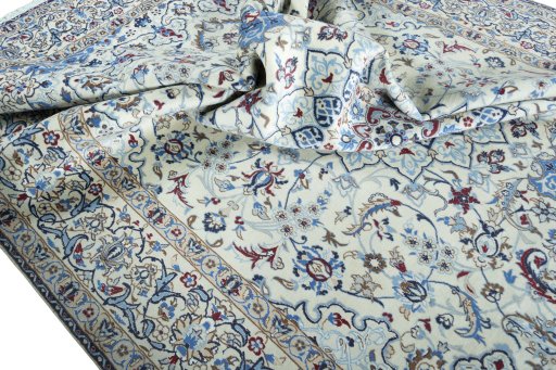 Surface texture of 2000s Nain rug with natural Wool and intricate pattern