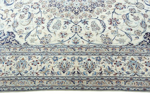 Corner detail of 2000s Nain rug showing border pattern and Wool pile