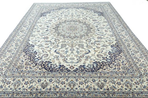 Surface texture of 2000s Nain rug with natural Wool and intricate pattern