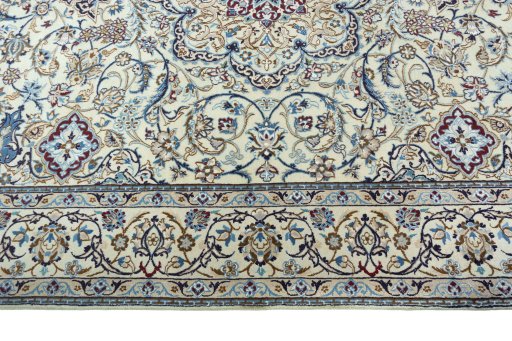 Corner detail of 2000s Nain rug showing border pattern and Wool pile