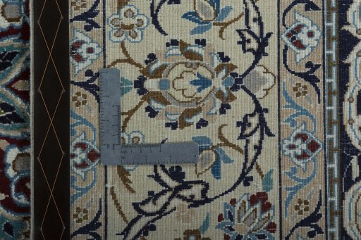 Backside of handmade 2000s Nain rug showing knot structure and weave density