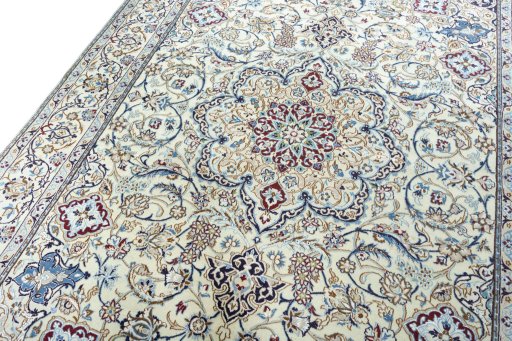 Backside of handmade 2000s Nain rug showing knot structure and weave density