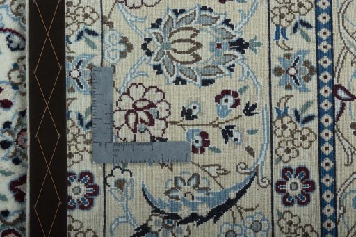 Backside of handmade New Nain rug showing knot structure and weave density