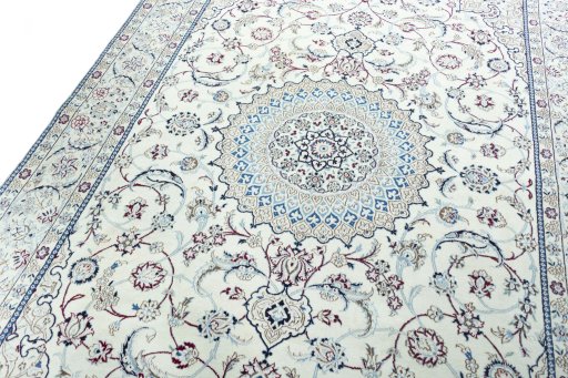 Backside of handmade New Nain rug showing knot structure and weave density