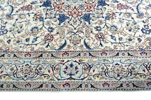 Corner detail of 2000s Nain rug showing border pattern and Wool pile