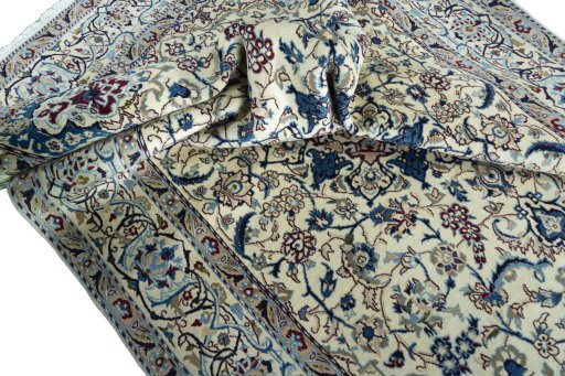 Surface texture of 2000s Nain rug with natural Wool and intricate pattern