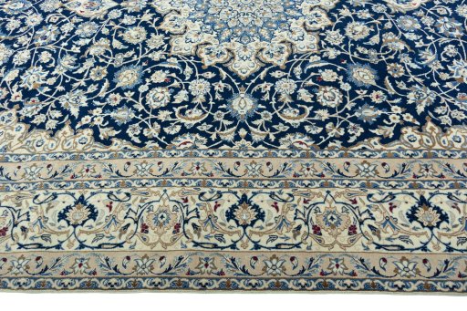 Corner detail of 2000s Nain rug showing border pattern and Wool pile