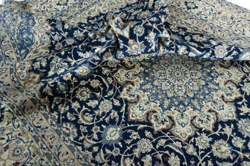 Surface texture of 2000s Nain rug with natural Wool and intricate pattern