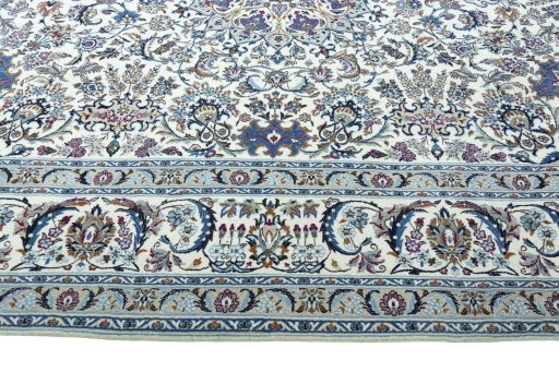 Corner detail of 2000s Nain rug showing border pattern and Wool pile