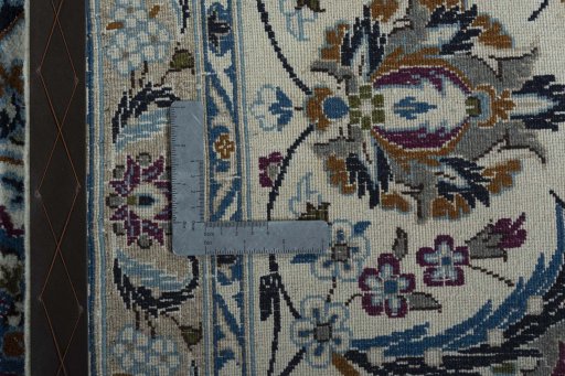 Backside of handmade 2000s Nain rug showing knot structure and weave density
