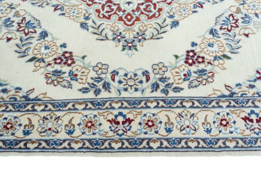 Corner detail of 2000s Nain rug showing border pattern and Wool pile
