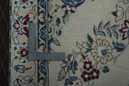 Surface texture of 2000s Nain rug with natural Wool and intricate pattern