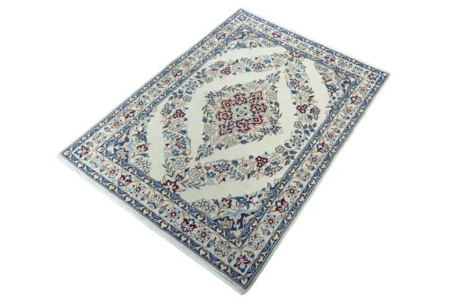 Corner detail of 2000s Nain rug showing border pattern and Wool pile