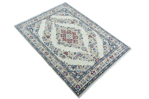 Close-up detail of 2000s Nain rug from Iran / Persia showing Wool weave