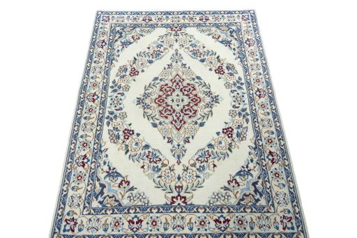 Surface texture of 2000s Nain rug with natural Wool and intricate pattern