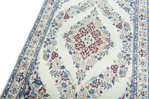Backside of handmade 2000s Nain rug showing knot structure and weave density