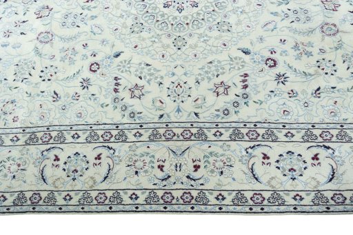 Corner detail of 2000s Nain rug showing border pattern and Wool pile