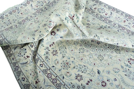 Surface texture of 2000s Nain rug with natural Wool and intricate pattern