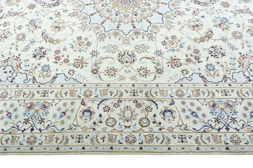Corner detail of 2000s Nain rug showing border pattern and Wool pile