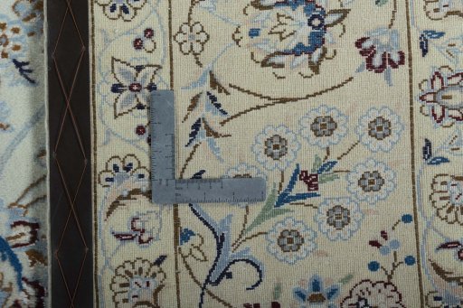 Backside of handmade 2000s Nain rug showing knot structure and weave density