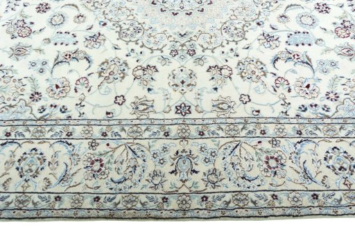 Corner detail of 2000s Nain rug showing border pattern and Wool pile