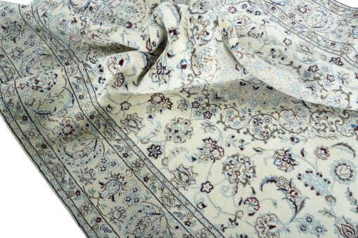 Surface texture of 2000s Nain rug with natural Wool and intricate pattern