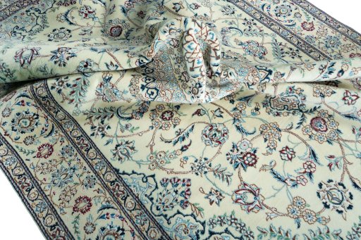 Surface texture of 2000s Nain rug with natural Wool and intricate pattern