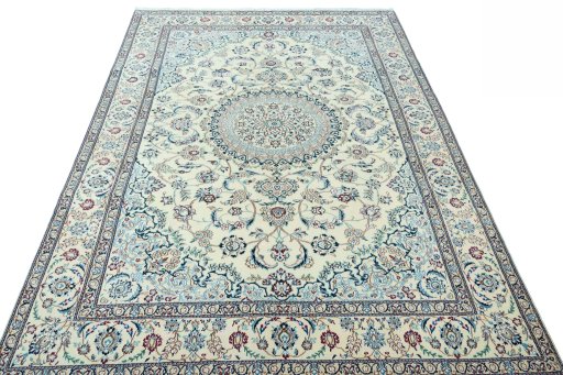 Surface texture of 2000s Nain rug with natural Wool and intricate pattern