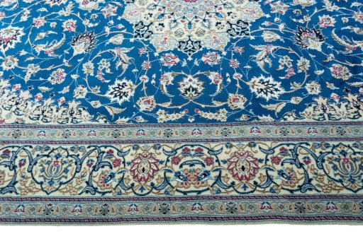 Corner detail of 2000s Nain rug showing border pattern and Wool pile