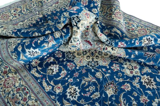 Surface texture of 2000s Nain rug with natural Wool and intricate pattern