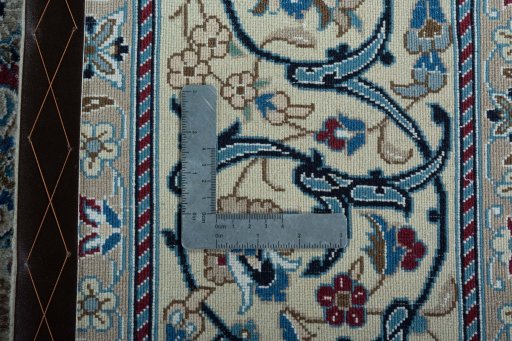 Backside of handmade 2000s Nain rug showing knot structure and weave density