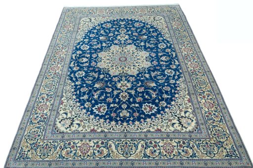 Surface texture of 2000s Nain rug with natural Wool and intricate pattern