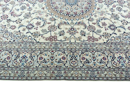 Corner detail of 2000s Nain rug showing border pattern and Wool pile