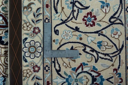 Backside of handmade 2000s Nain rug showing knot structure and weave density