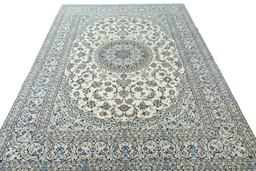 Surface texture of 2000s Nain rug with natural Wool and intricate pattern