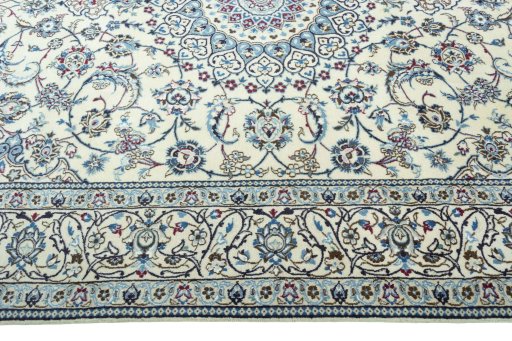 Corner detail of 2000s Nain rug showing border pattern and Wool pile