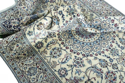 Surface texture of 2000s Nain rug with natural Wool and intricate pattern