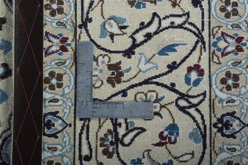 Backside of handmade 2000s Nain rug showing knot structure and weave density