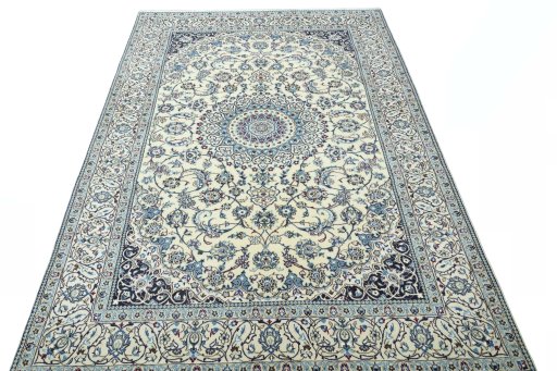 Surface texture of 2000s Nain rug with natural Wool and intricate pattern