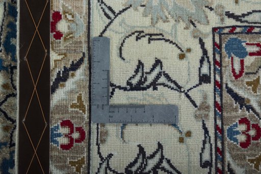 Backside of handmade New Nain rug showing knot structure and weave density