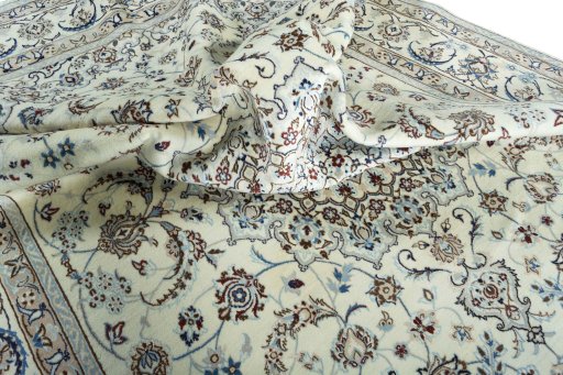 Surface texture of 2000s Nain rug with natural Wool and intricate pattern