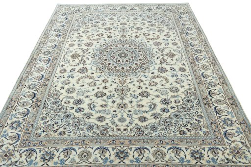 Surface texture of 2000s Nain rug with natural Wool and intricate pattern