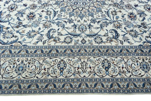 Corner detail of 2000s Nain rug showing border pattern and Wool pile