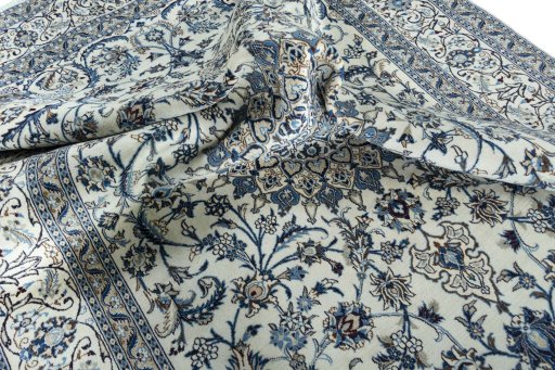 Surface texture of 2000s Nain rug with natural Wool and intricate pattern
