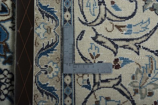 Backside of handmade 2000s Nain rug showing knot structure and weave density