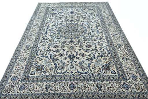 Surface texture of 2000s Nain rug with natural Wool and intricate pattern