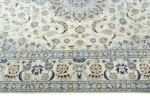 Corner detail of 2000s Nain rug showing border pattern and Wool pile