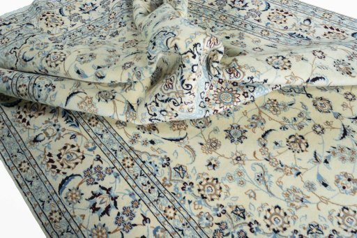 Surface texture of 2000s Nain rug with natural Wool and intricate pattern