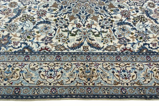 Corner detail of 2000s Nain rug showing border pattern and Wool pile